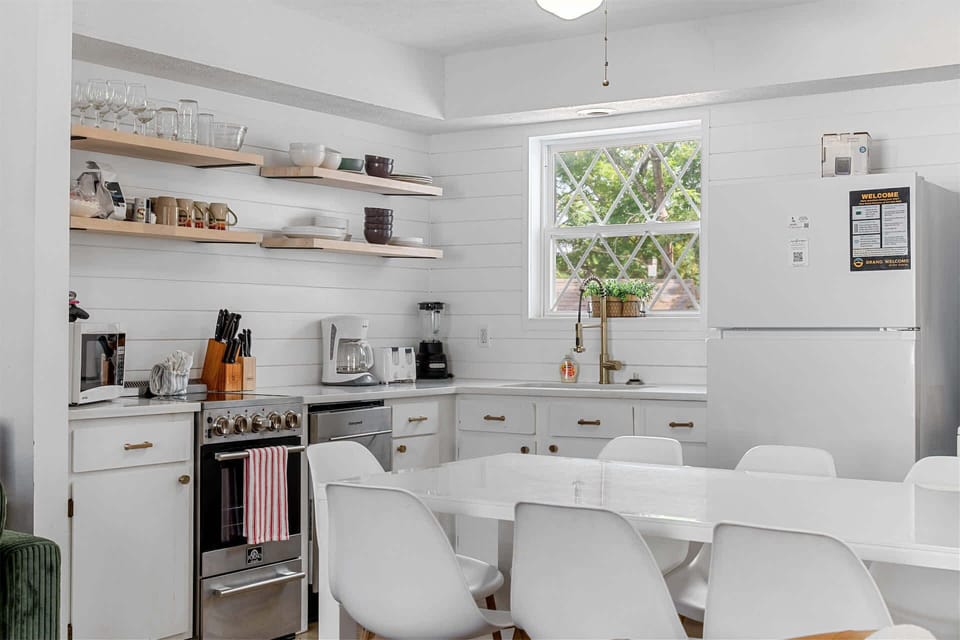 The elegant kitchen offers ample space & all the comforts of home