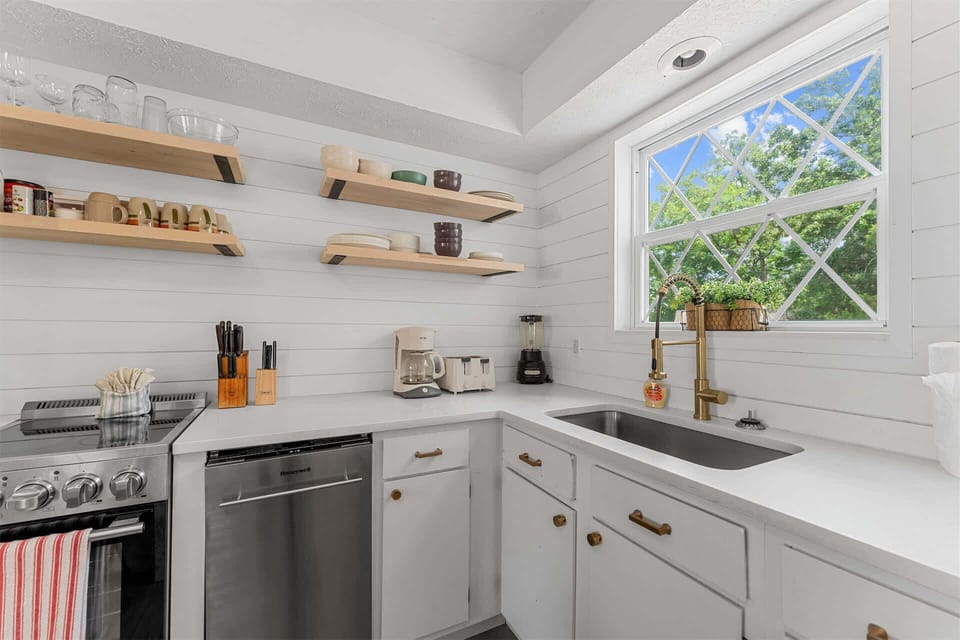 The elegant kitchen offers ample space & all the comforts of home