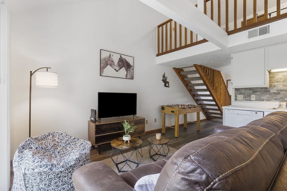 Cozy and spacious living area with TV