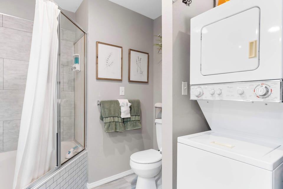 This ensuite bath features a double vanity & shower/soaking tub combo