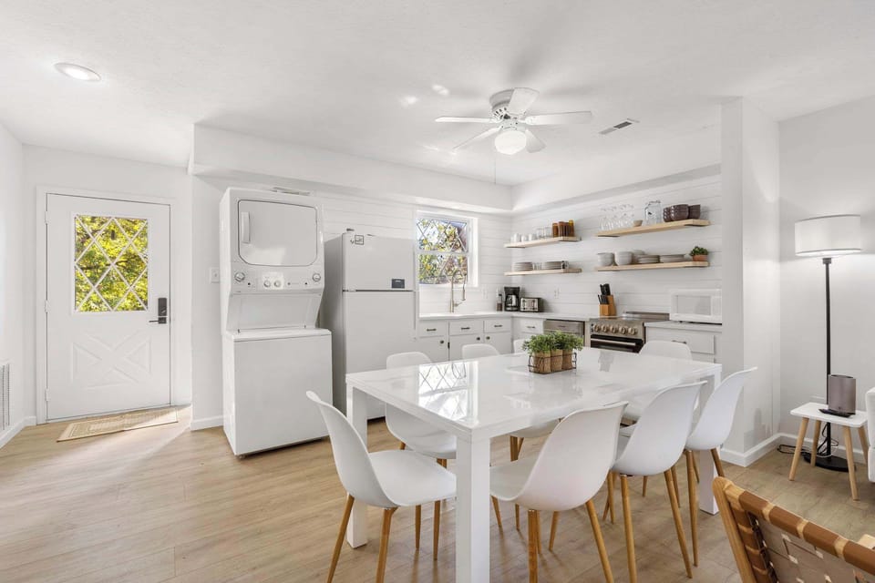 Gather for meals in the open dining area, offering seating for 8