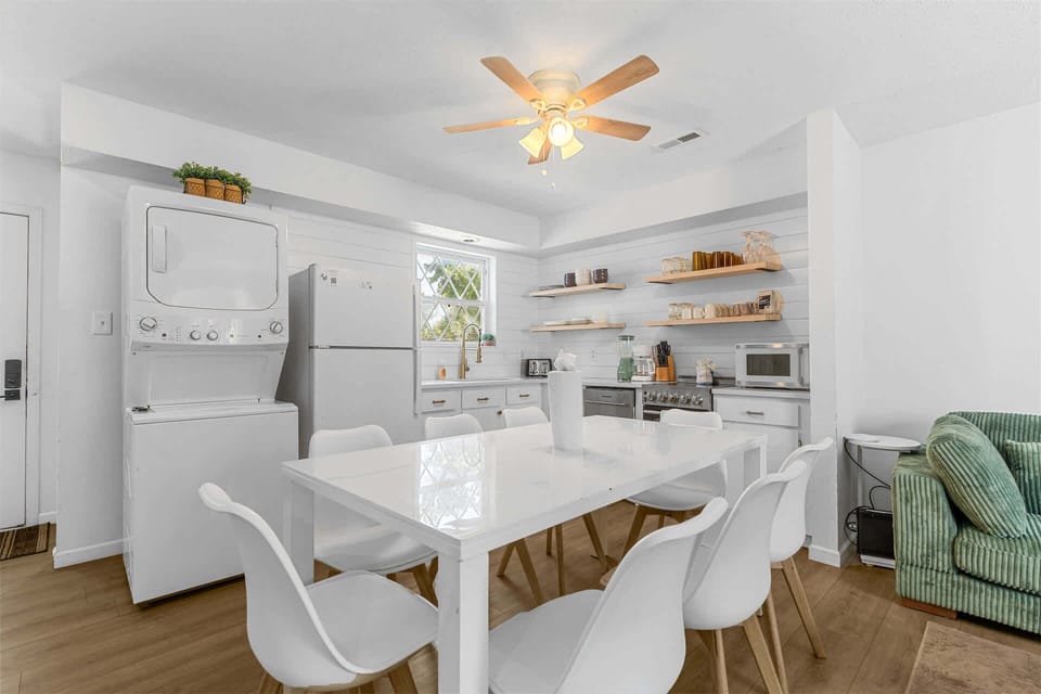 Gather for meals in the open dining area, offering seating for 8