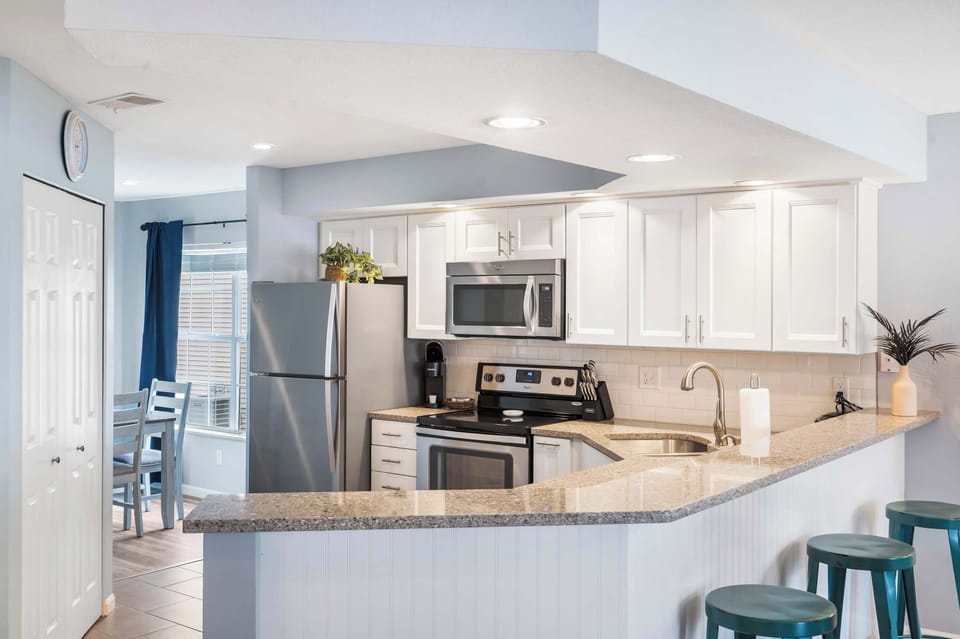 Sip morning coffee or grab a bite at the kitchen counter, with seating for 3