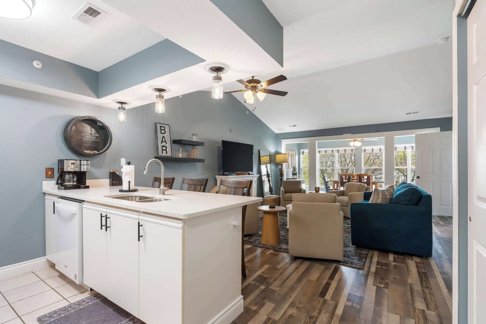The open, breezy kitchen offers ample space & every home comfort