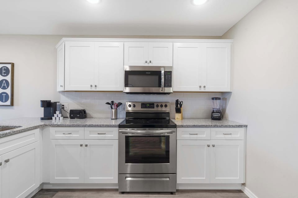Full kitchen stocked with a blender, coffee maker, toaster and more!