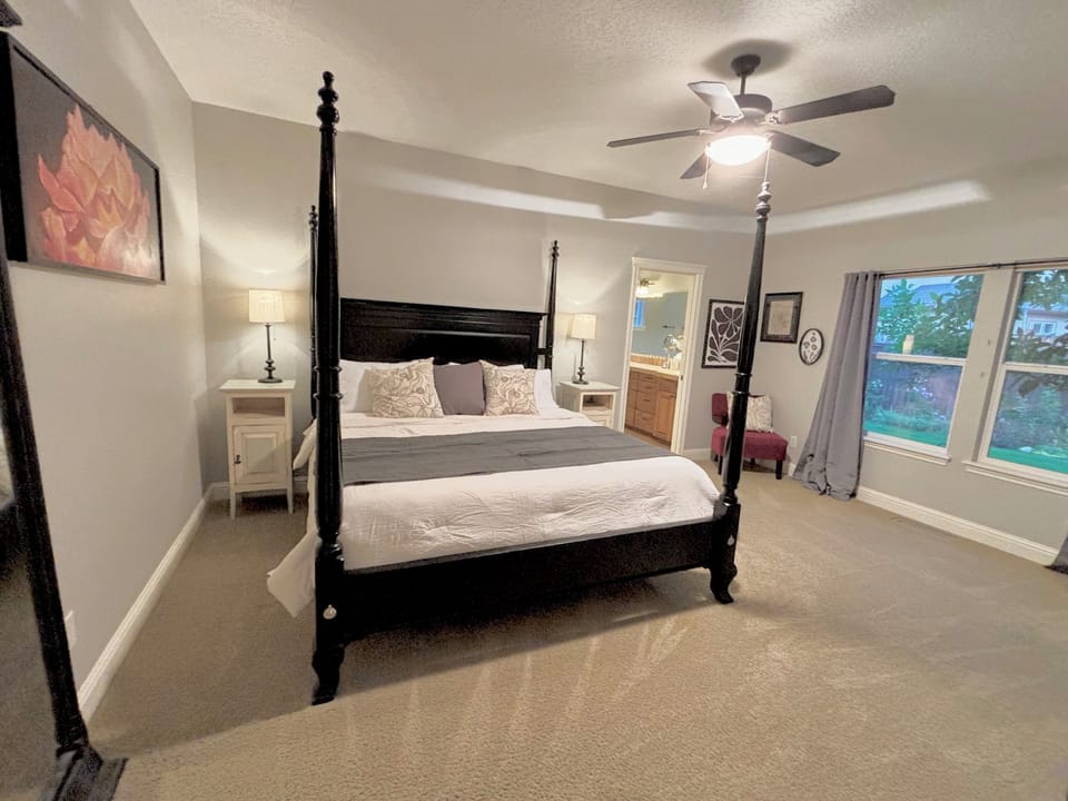 Main floor master suite with en suite with garden tub & large TV