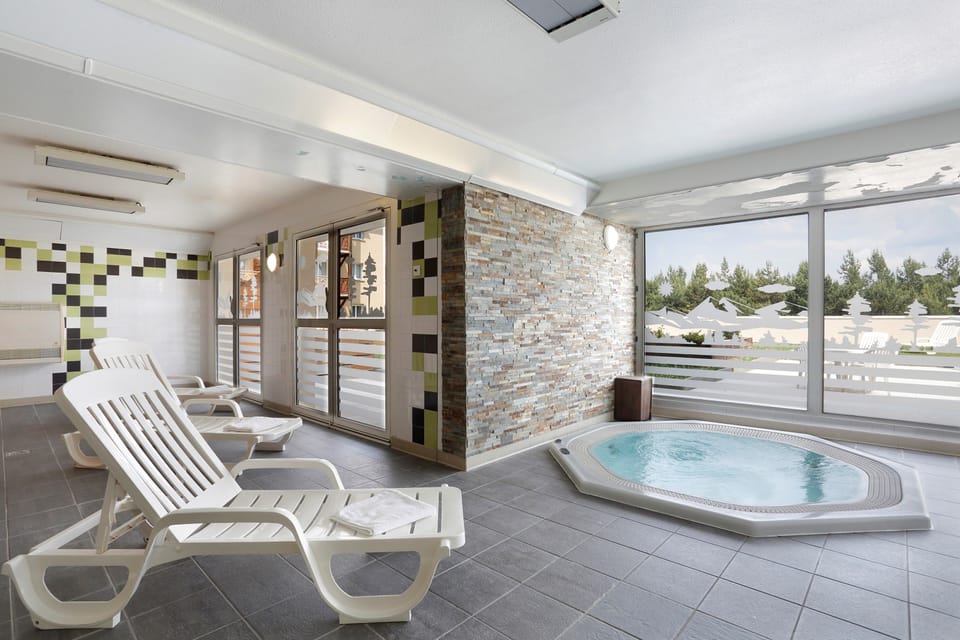 Relax and enjoy the shared hot tub in the paid wellness centre!