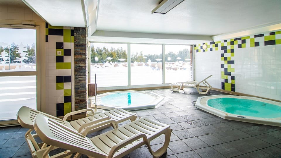 Spend time soothing your muscles in the shared indoor hot tub in the wellness centre.