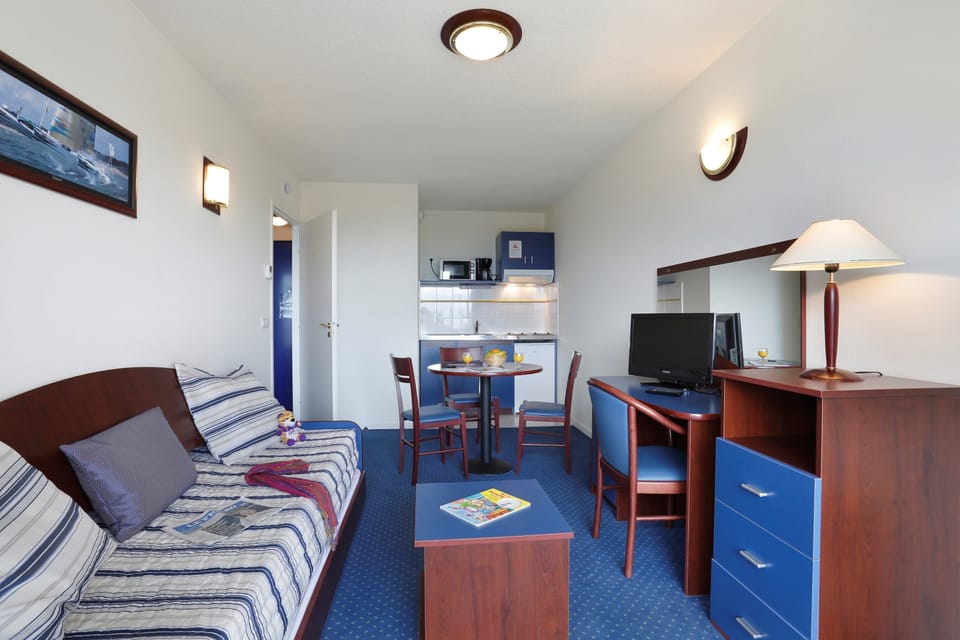 Prepare meals in the kitchenette and enjoy them at the dining table.