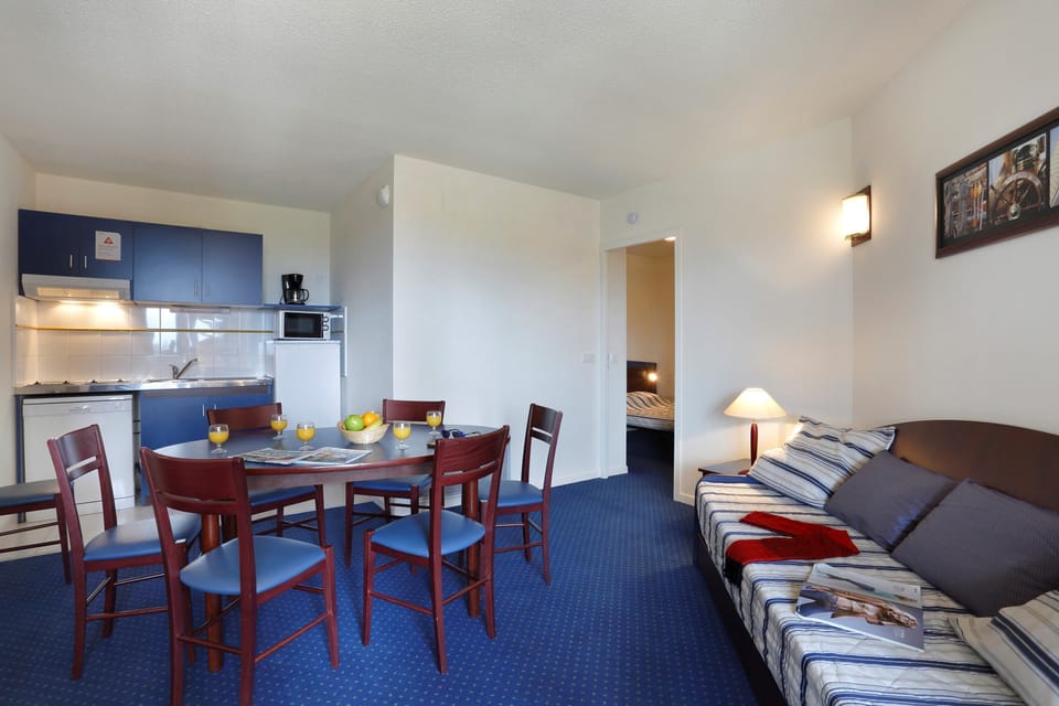 Prepare meals in the kitchenette and enjoy them at the dining table.