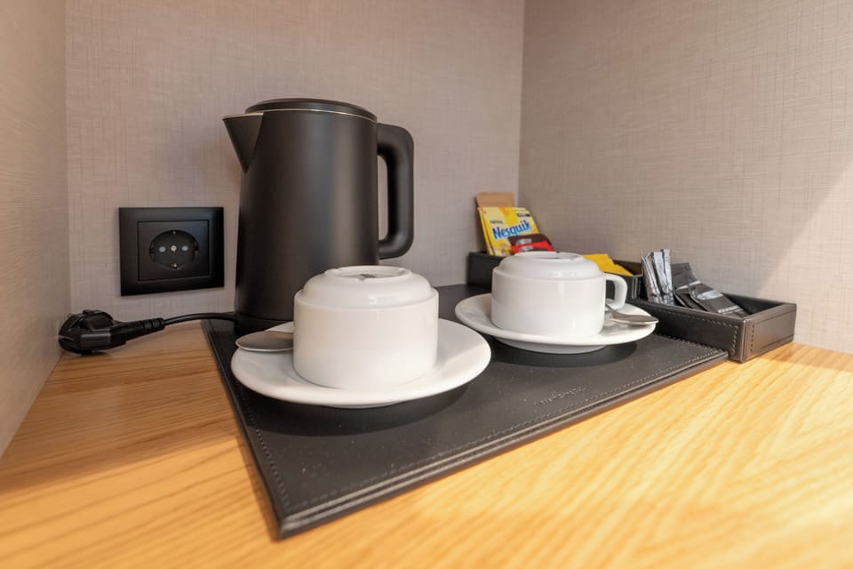 Deluxe Double Room, Courtyard View | In-room safe, desk, laptop workspace, soundproofing