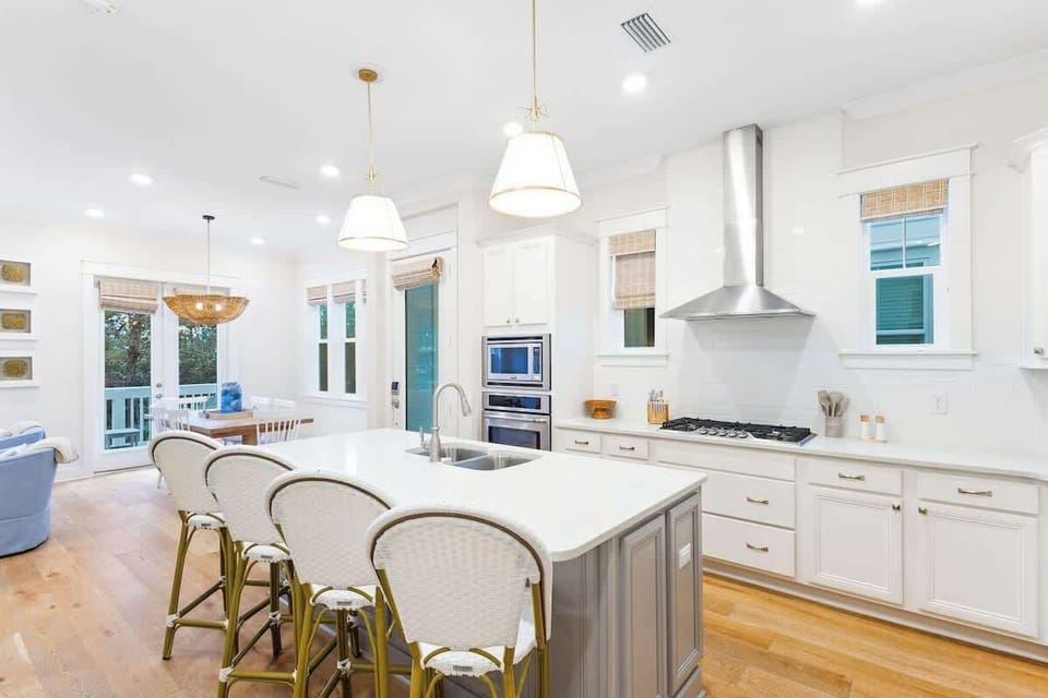 Kitchen island features seating for an additional 4.