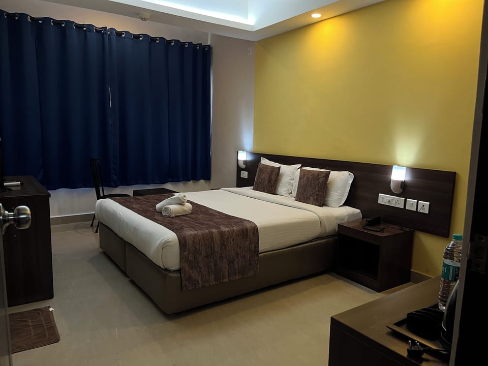Down comforters, laptop workspace, blackout drapes, iron/ironing board