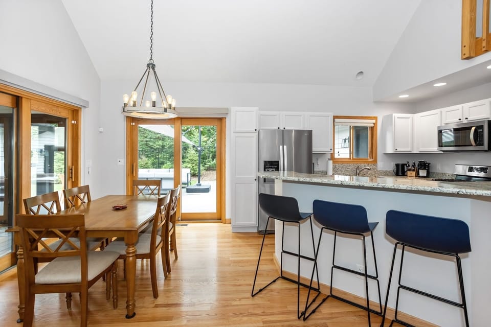 Spacious dining area connected to the kitchen and living room.