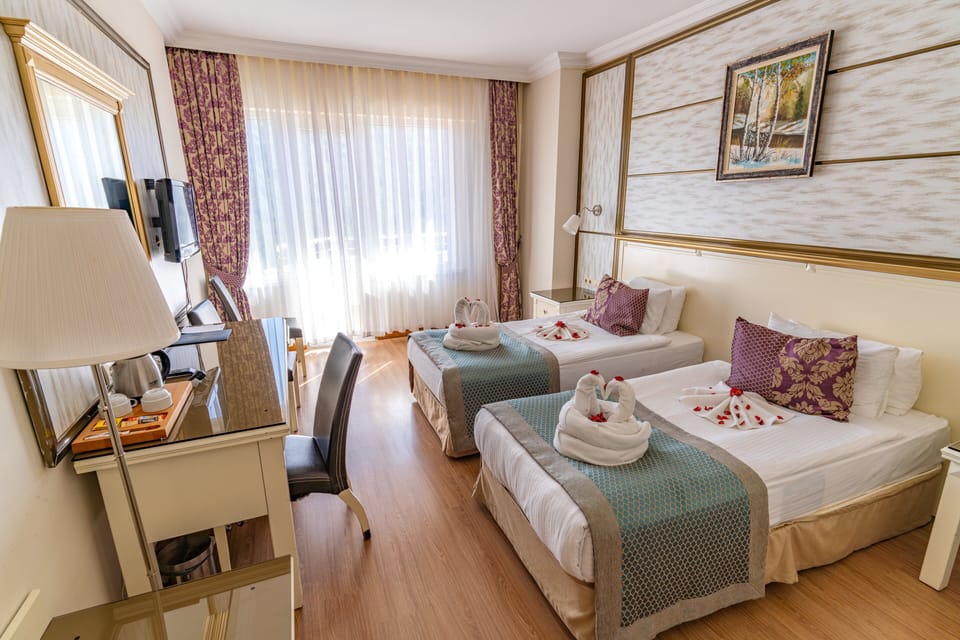 Standard Double or Twin Room, Balcony, Partial Lake View | In-room safe, free WiFi, bed sheets