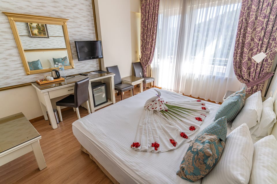 Standard Double or Twin Room, Balcony, Partial Lake View | In-room safe, free WiFi, bed sheets