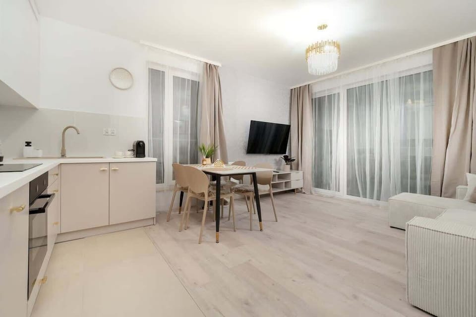 Stylish kitchenette with dining and living area offers the perfect combination of functionality and aesthetics.