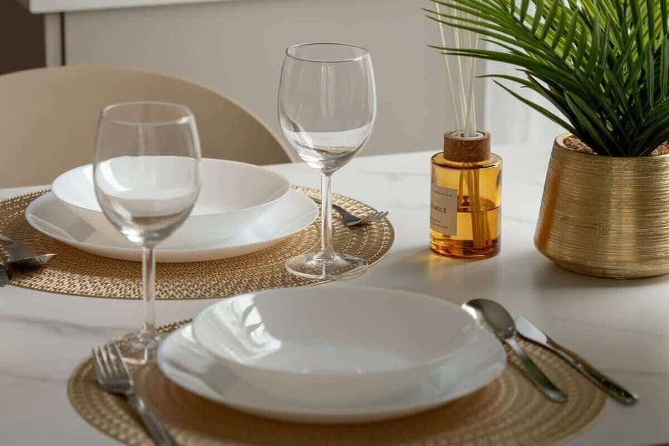 Close-up of tableware and glasses shows attention to every detail of the furnishings.