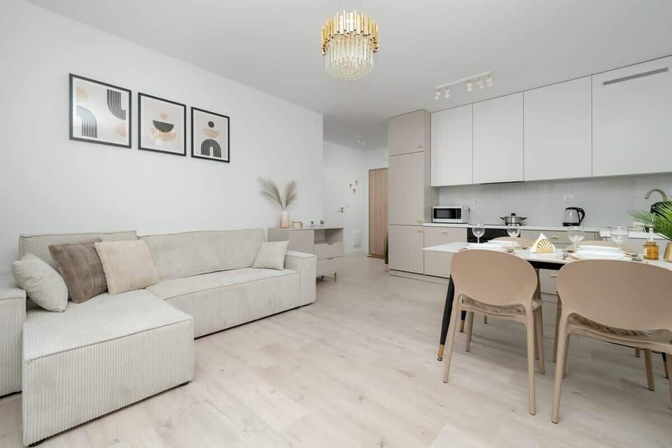 Spacious living room with kitchenette and dining area creates a comfortable and functional living space.