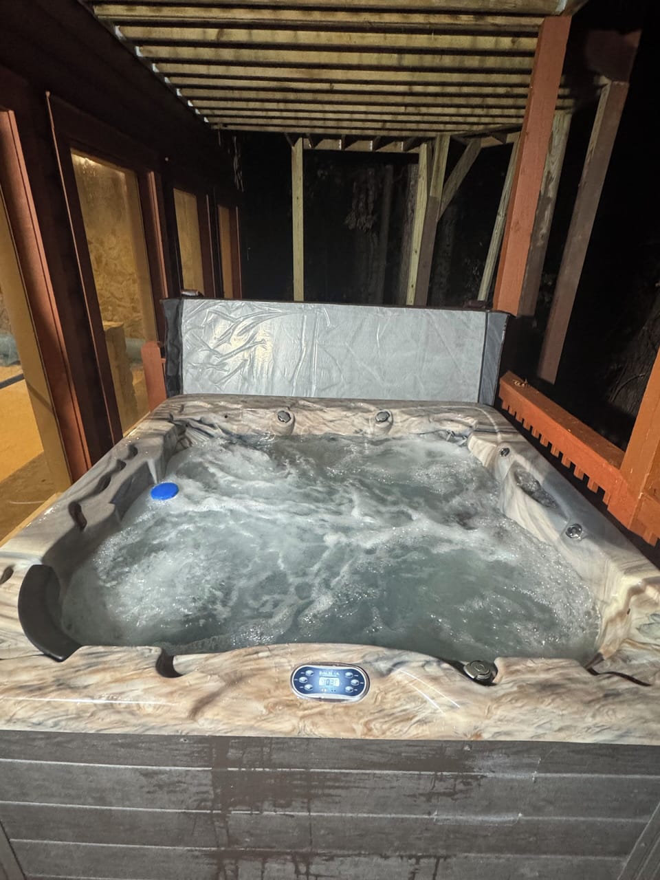 Take a moment to unwind in your private hot tub after a day of exploring.