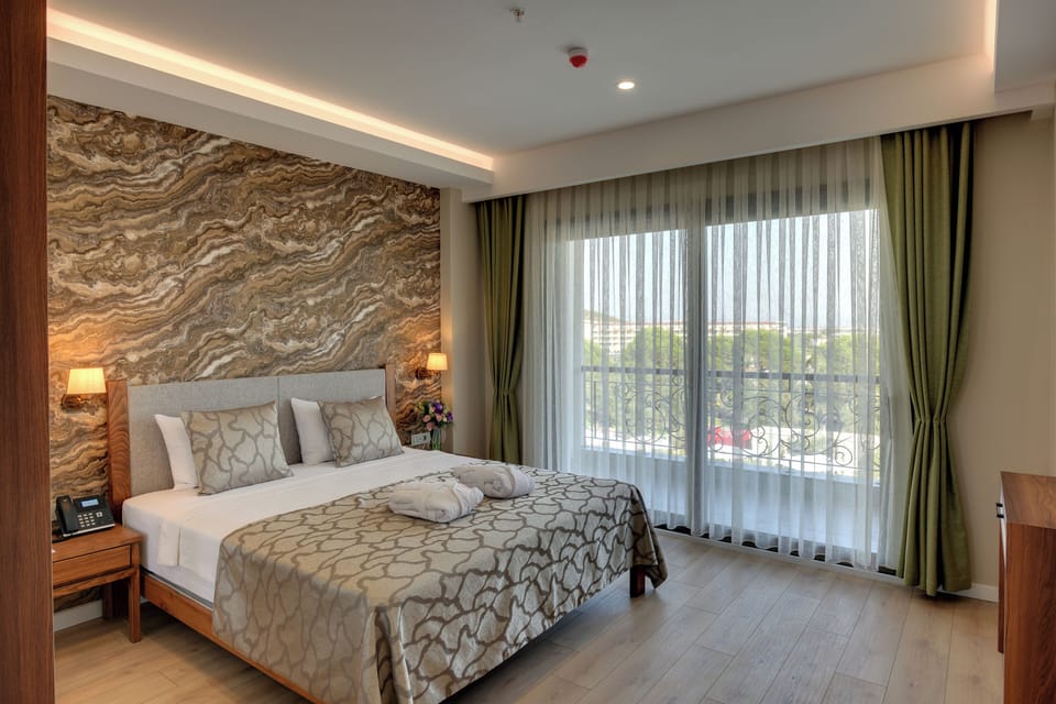 Grand Suite, Balcony, Sea View | Minibar, in-room safe, desk, laptop workspace