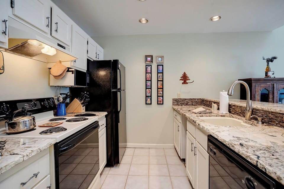 Your fully equipped galley kitchen features granite countertops, modern appliances, and everything you need to create memorable meals during your stay.