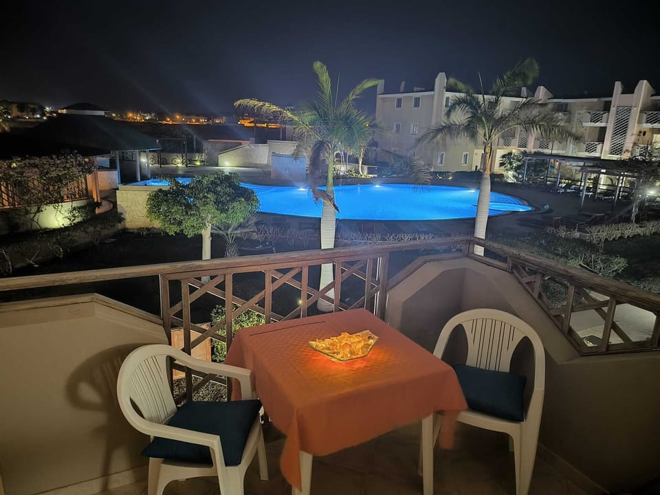 Balcony and pool at night