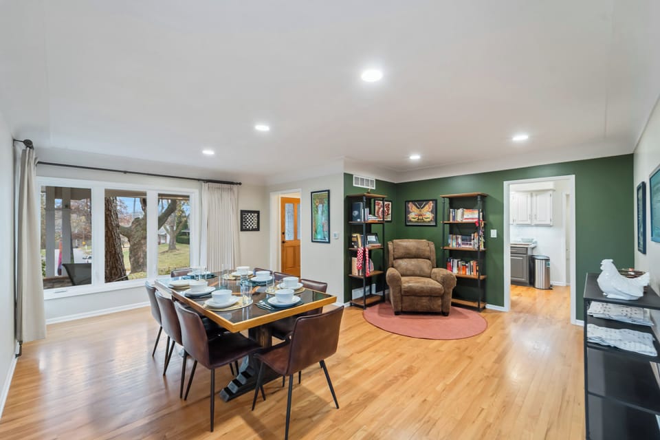 The handmade dining table comfortably seats 8 and there's plenty of dishes for up to 12+ located in the upstairs kitchen. 