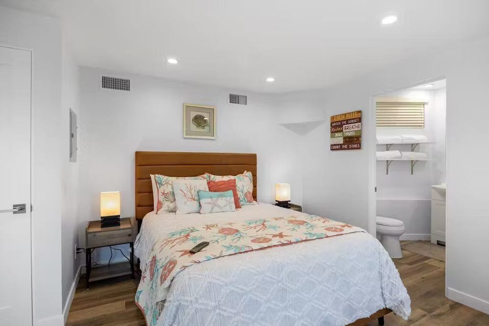 Comfort meets convenience with a cozy queen bed and a bathroom right next door.