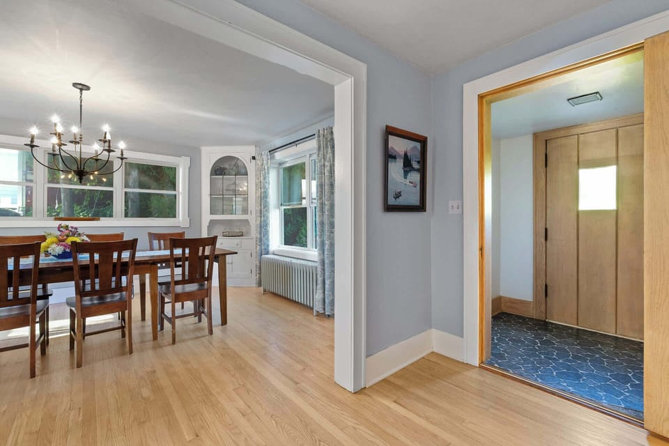 Front door enters into bright sitting room and dining room