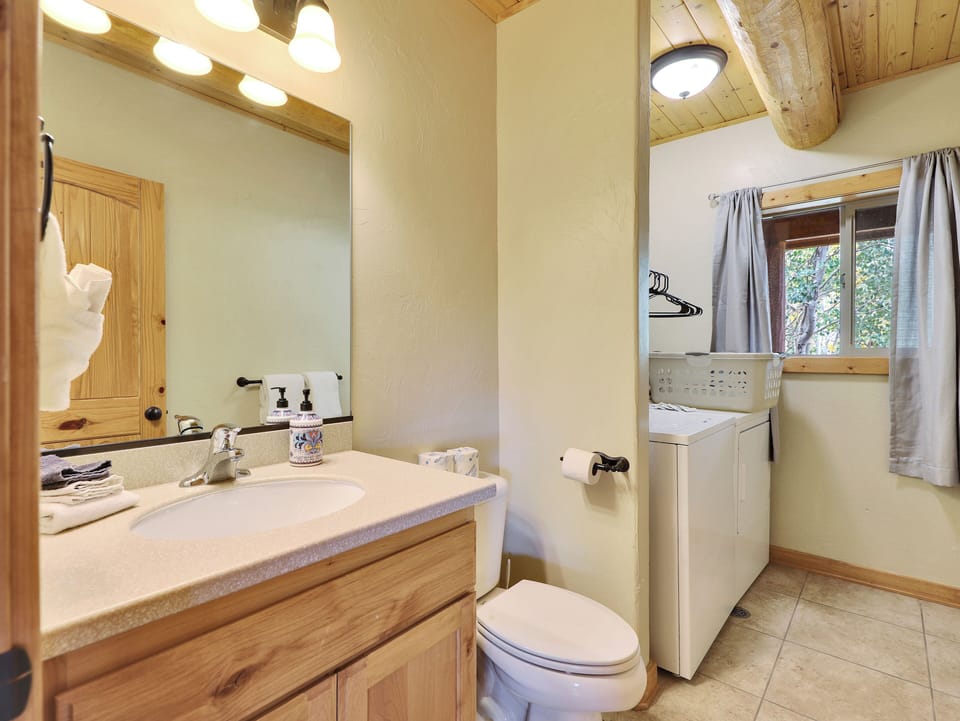 Main Level Half Bathroom/Laundry RM