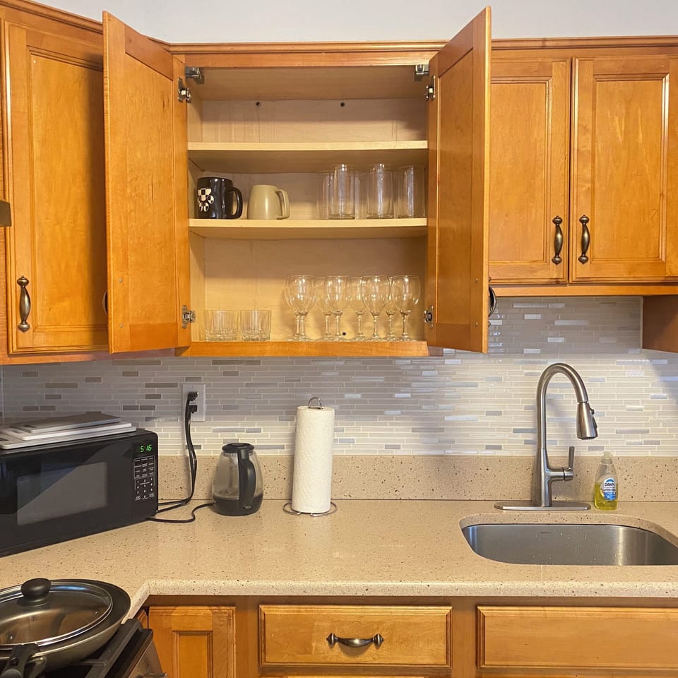 Fully Stocked Cabinet with Wine Glasses, Mugs, Appliances, etc.