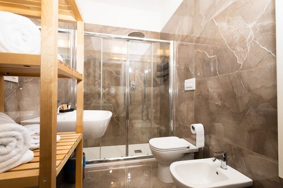 Family Studio Suite, 1 Bedroom, Kitchenette, Ground Floor | Bathroom | Shower, rainfall showerhead, free toiletries, hair dryer