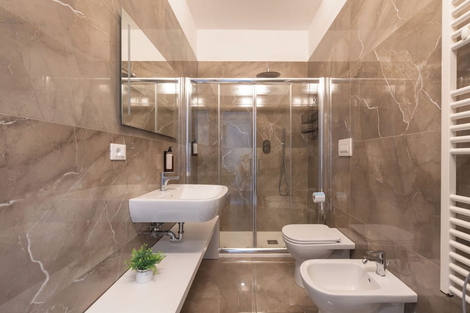 Family Quadruple Room, Balcony, Courtyard View | Bathroom | Shower, rainfall showerhead, free toiletries, hair dryer