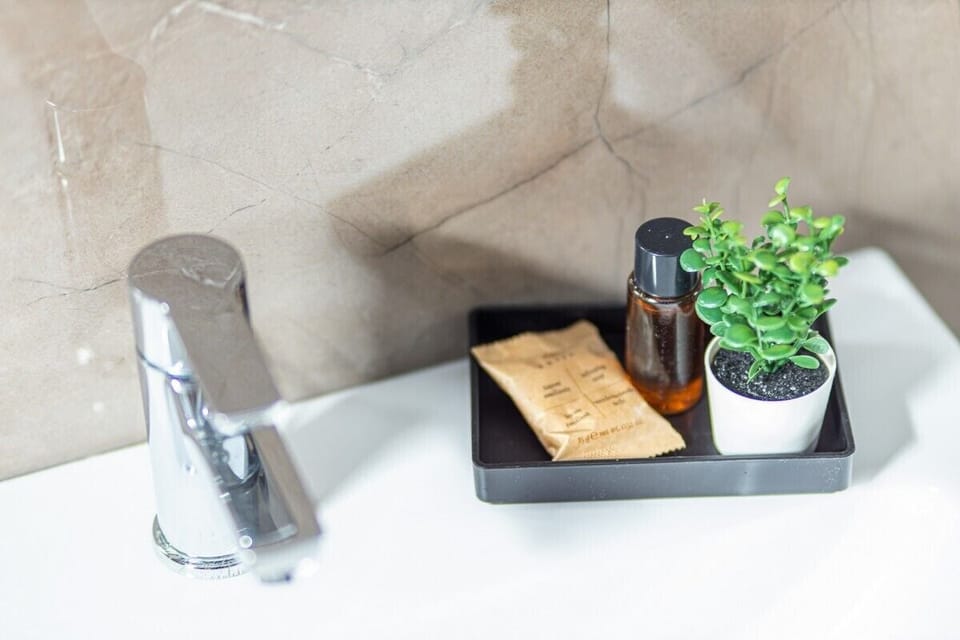 Family Quadruple Room, Air conditioning, Courtyard View | Bathroom | Shower, rainfall showerhead, free toiletries, hair dryer