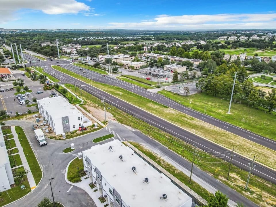 A charming exterior with a welcoming vibe, surrounded by peaceful greenery and ample parking space.