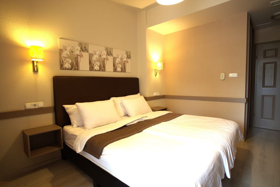 Standard Double Room, Balcony, City View | In-room safe, blackout drapes, soundproofing, iron/ironing board