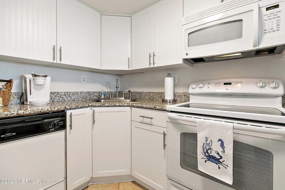Fully stocked kitchen, pots, pans, dishes, Keurig, toaster, blender