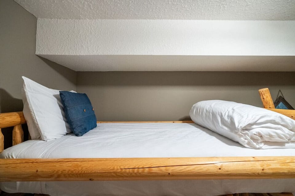 Third bedroom (on the main level) with a twin-over-queen bunk bed & a closet.