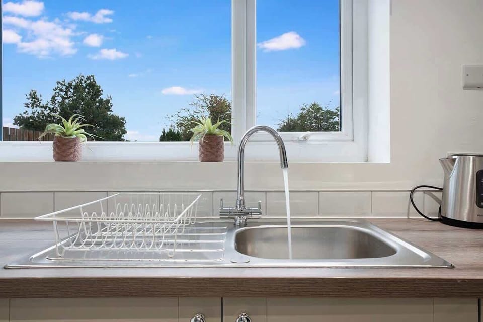 Family-friendly kitchen oasis equipped with all essentials, including a washer & dryer, oven, fridge and full cookware set. Plus, thoughtful touches like children's dinnerware ensure everyone feels right at home in this cozy culinary haven.