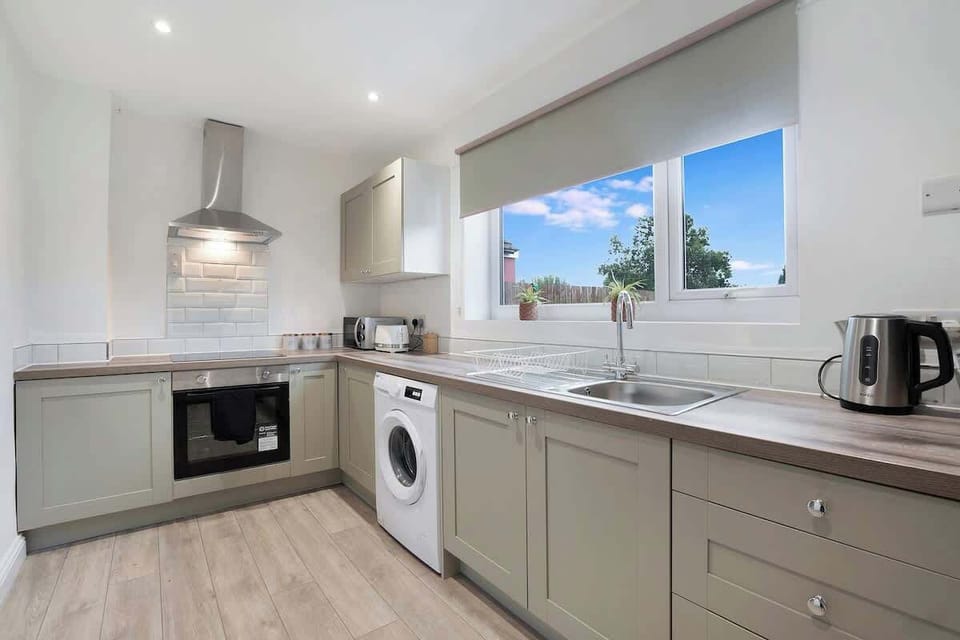 Family-friendly kitchen oasis equipped with all essentials, including a washer & dryer, oven, fridge and full cookware set. Plus, thoughtful touches like children's dinnerware ensure everyone feels right at home in this cozy culinary haven.