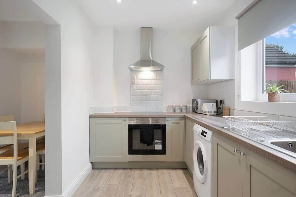 Family-friendly kitchen oasis equipped with all essentials, including a washer & dryer, oven, fridge and full cookware set. Plus, thoughtful touches like children's dinnerware ensure everyone feels right at home in this cozy culinary haven.