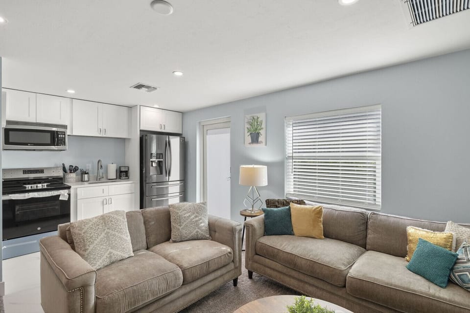 Modern guest lounge offering plush seating near the outdoor entrance.