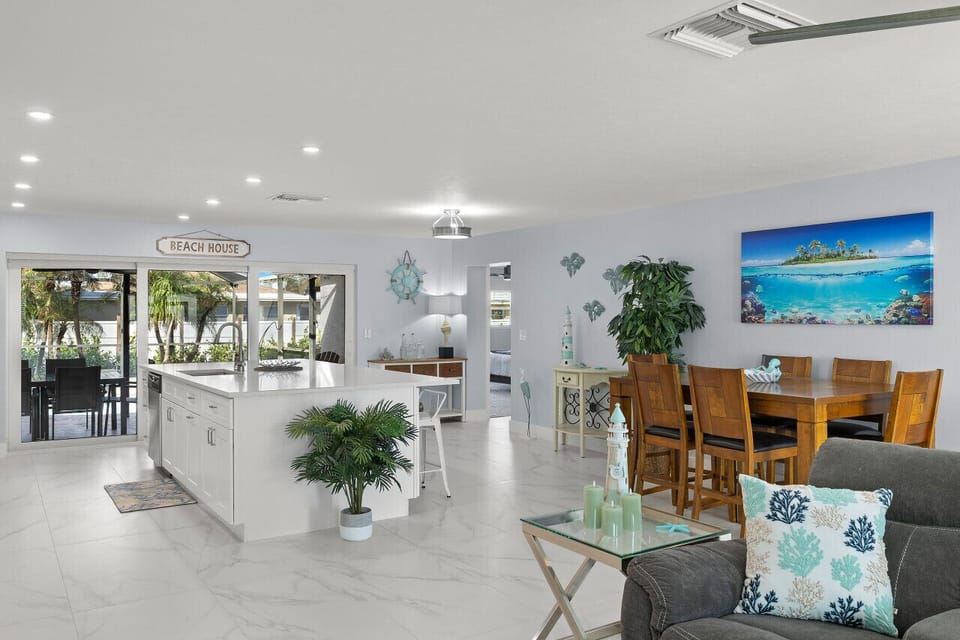 Spacious dining area offering a large table near the kitchen.