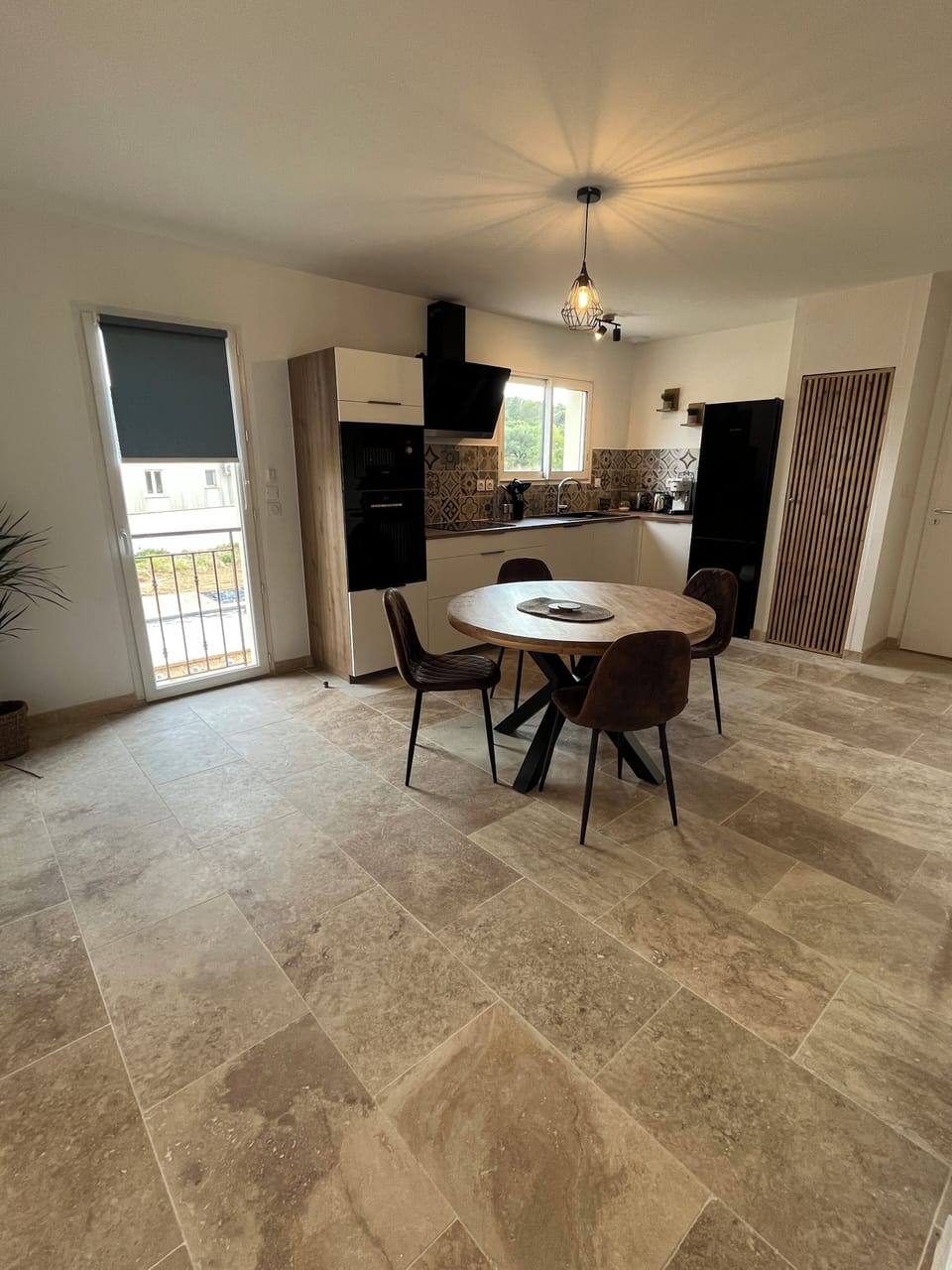 The modern fully equipped kitchen with dining area