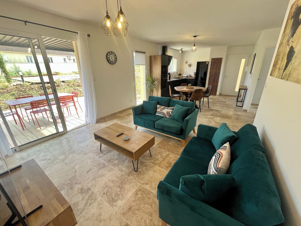 The spacious & bright living area with fully equipped kitchen & dining area