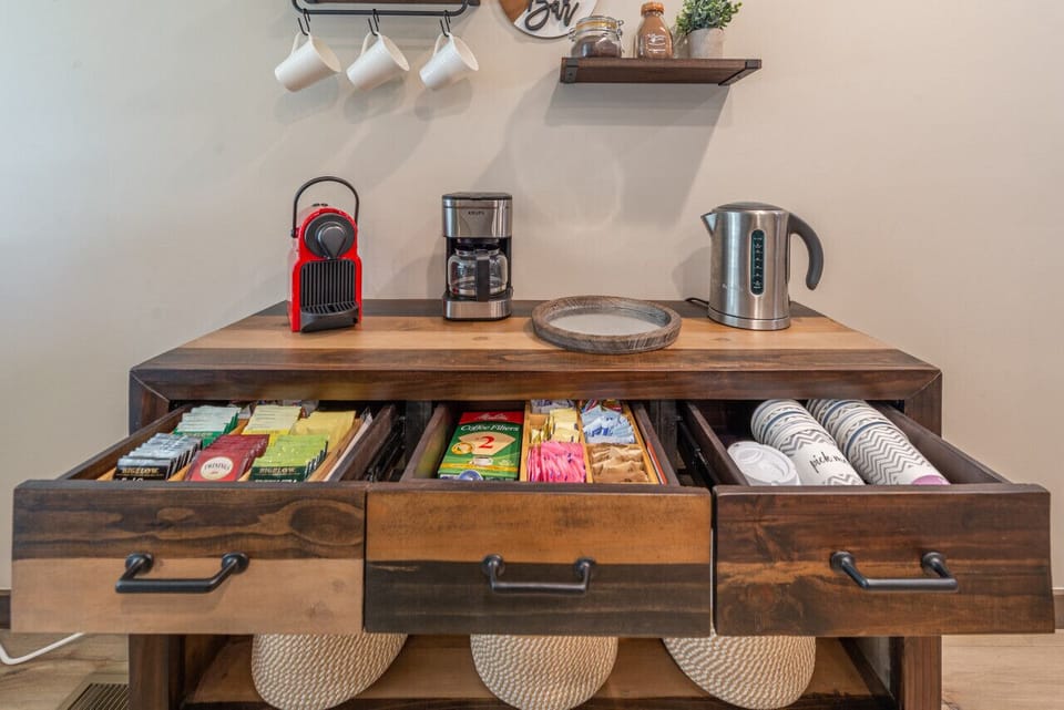 Coffee, tea and hot chocolate bar with espresso machine, drip machine, pour over coffee, and tea kettle. Complimentary Peet`s coffee, tea, hot chocolate, and sweeteners.