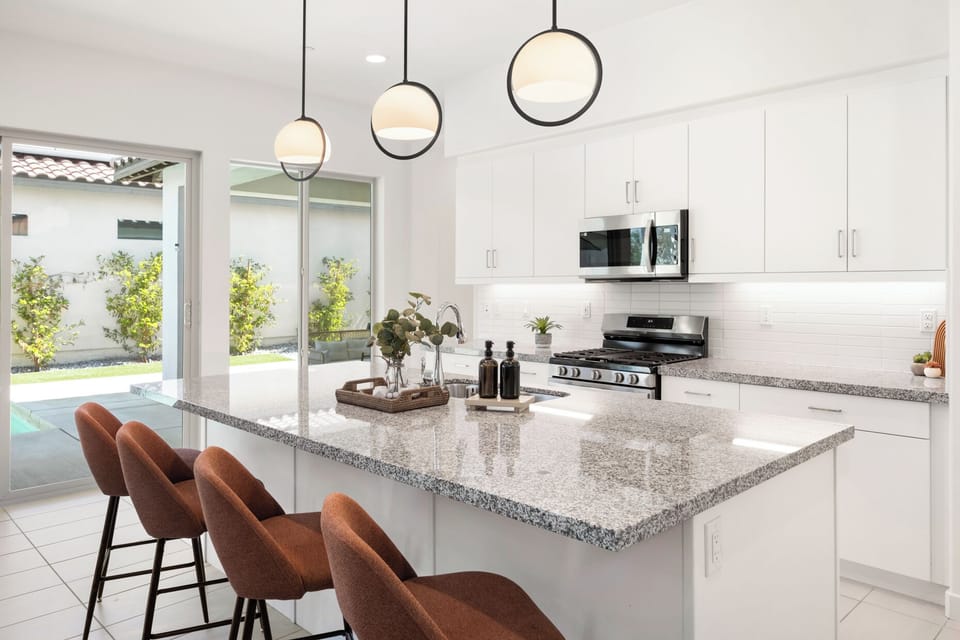 Kitchen island makes it easy to chat while cooking meals together.