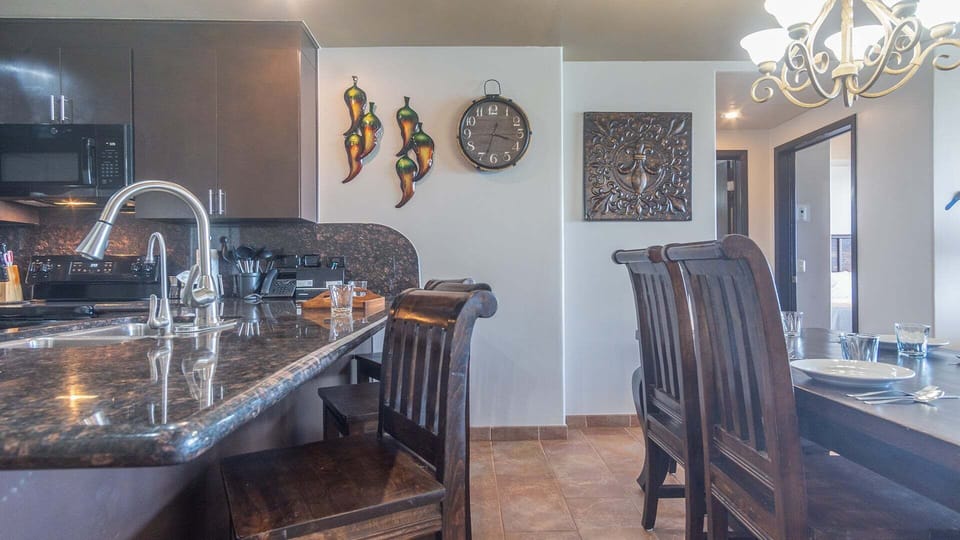 Additional seating at the kitchen counter.