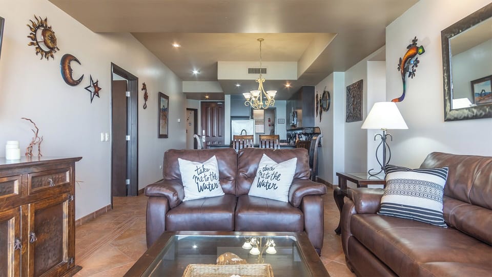 The living room and kitchen .